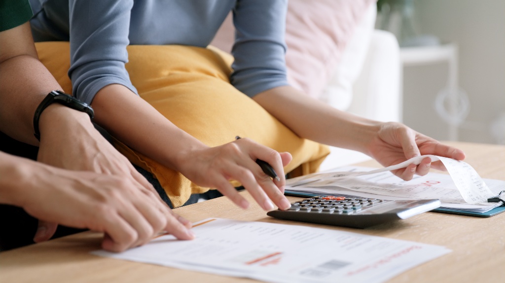 Two people looking over funds