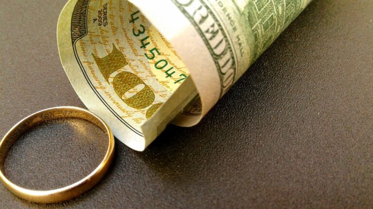 dollar bill and wedding ring