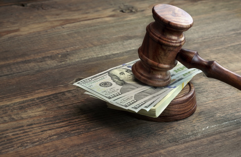judge's gavel and a wad of bills