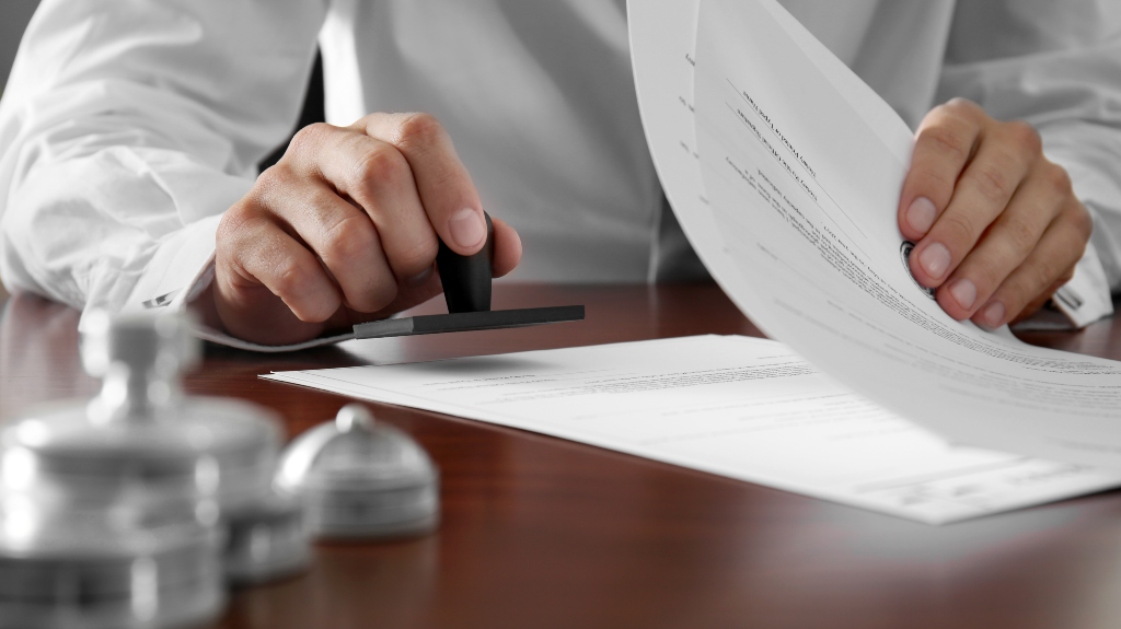 The notary puts a stamp on the will