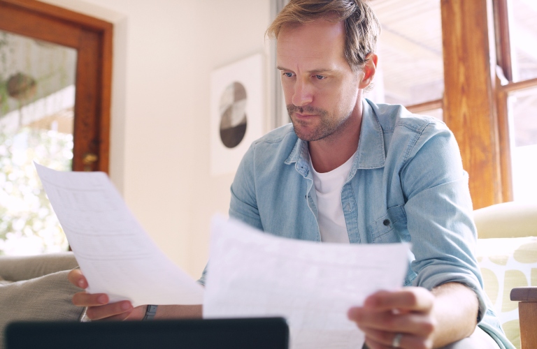 man is reviewing documents